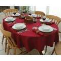 Burgundy oval tablecloth, having wine and dinner at home
