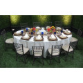 Wedding reception in garden beautiful oval table set