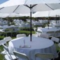 White tablecloth with umbrella hole.