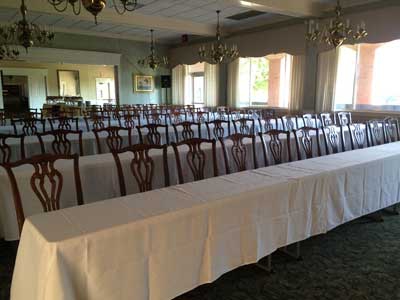 8 foot rectangular classroom tables dressed with a 78 inch by 156 inch Havana Tablecloth