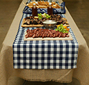 checkered polyester tablecloth on a rustic burlap tablecloth