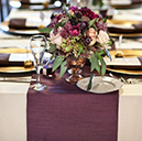 polyester premier table runner burgundy on table