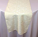 Saxony Damask table runner on white tablecloth